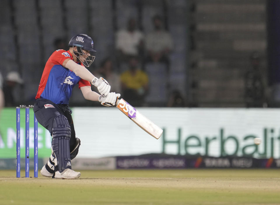 Delhi Capital's David Warner hits a boundary during the Indian Premier League (IPL) cricket match between Delhi Capitals and Gujarat Titans in New Delhi, India, Tuesday, April 4, 2023. (AP Photo/Manish Swarup)