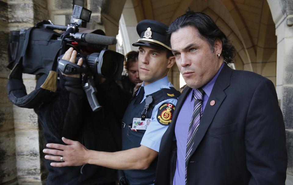 Senator Patrick Brazeau leaves Parliament Hill in Ottawa