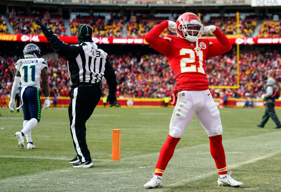 Kansas City Chiefs cornerback Trent McDuffie (21) celebrates after an interception by safety Juan Thornhill (not pictured) during the second half against the Seattle Seahawks at GEHA Field at Arrowhead Stadium in Kansas City, Missouri, on Dec. 24, 2022.
