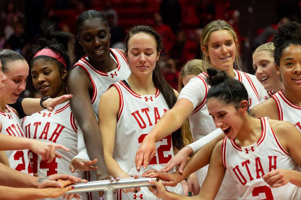 Utah Utes players light the U after their victory in their women’s college basketball game against Weber State University at the Jon M. Huntsman Center in Salt Lake City on Thursday, Dec. 21, 2023. | Megan Nielsen, Deseret News