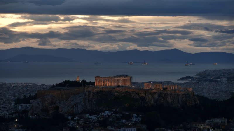 FILE PHOTO: The Parthenon temple is seen atop the Acropolis hill at dusk, in Athens