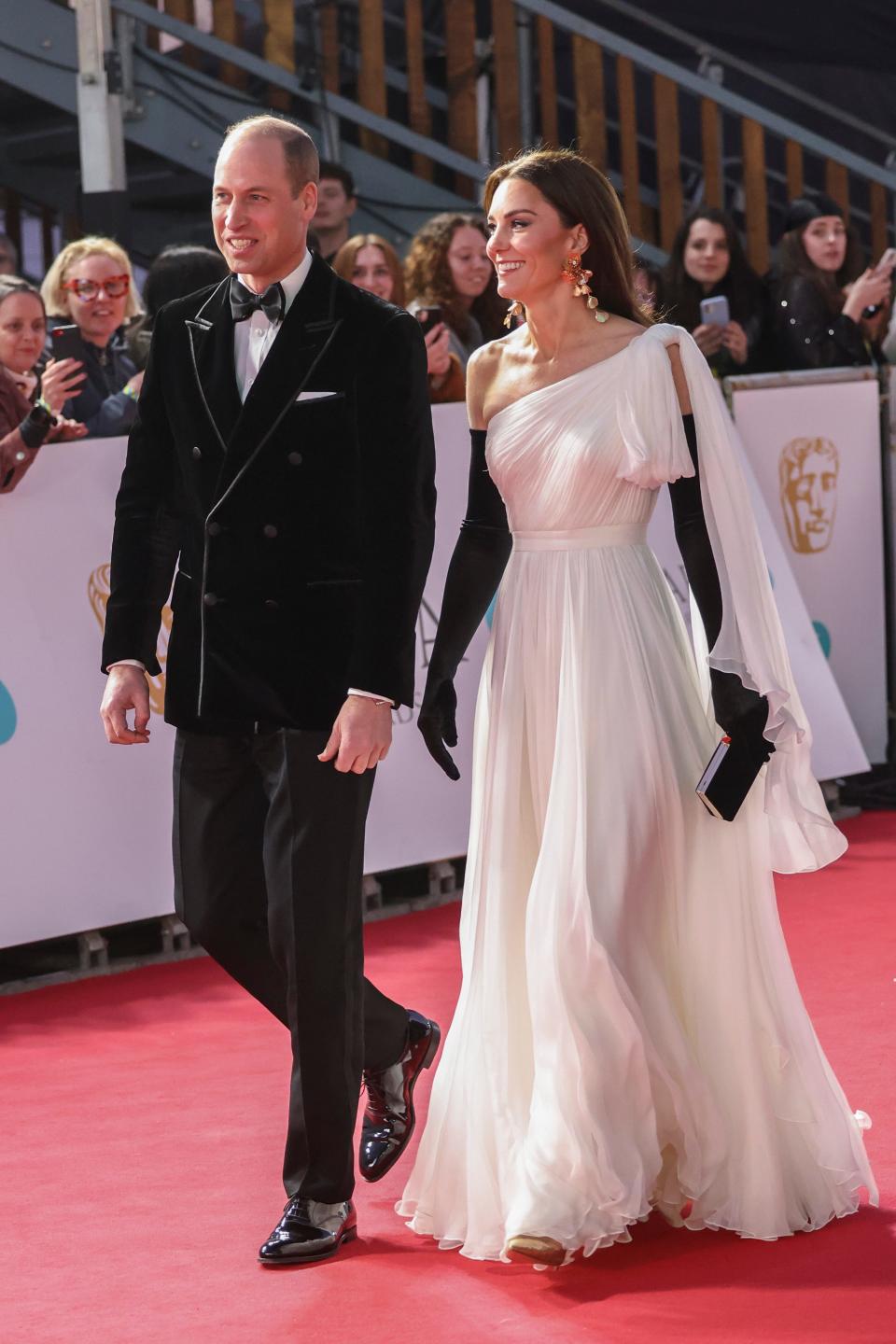 Britain's Prince William, left, and his wife Kate the Princess of Wales pose for photographers upon arrival at the 76th British Academy Film Awards, BAFTA's, in London, Sunday, Feb. 19, 2023
