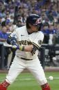 Milwaukee Brewers' Keston Hiura is hit by a pitch during the fifth inning of a baseball game against the Chicago Cubs Monday, July 4, 2022, in Milwaukee. (AP Photo/Morry Gash)