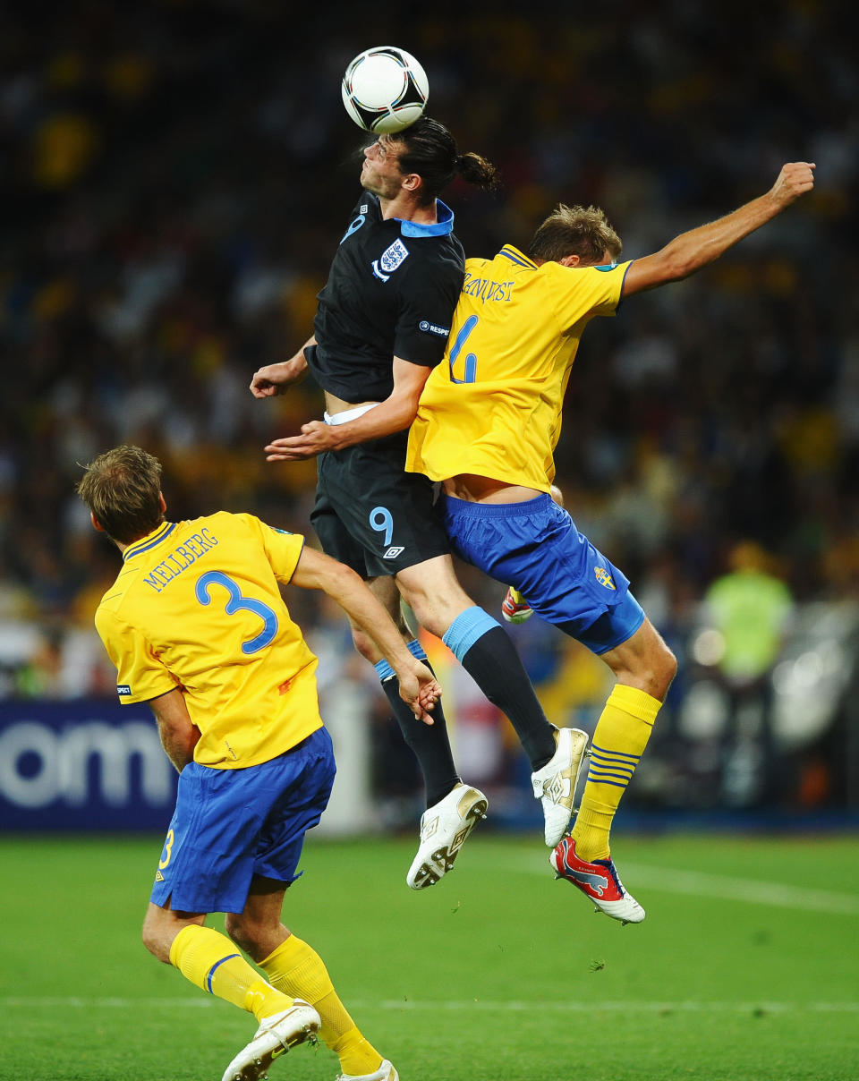 KIEV, UKRAINE - JUNE 15: Andy Carroll of England beats Rasmus Elm of Sweden to the ball during the UEFA EURO 2012 group D match between Sweden and England at The Olympic Stadium on June 15, 2012 in Kiev, Ukraine. (Photo by Laurence Griffiths/Getty Images)