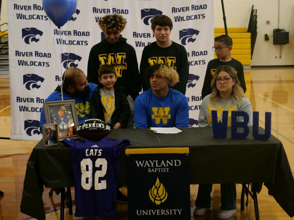 River Road's Davian Perkins (seated second from the right) signed his National Letter of Intent to play football for Wayland Baptist University as part of National Signing Day on Wednesday, February 1, 2023 at River Road High School.