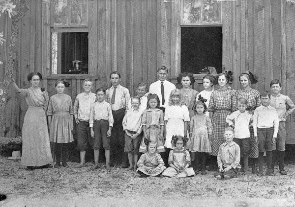 A teacher and students of the Johnson School, the earliest iteration of today’s Alturas Elementary, in 1911. The school has been at its current site since 1920, and the existing building dates to 1947.