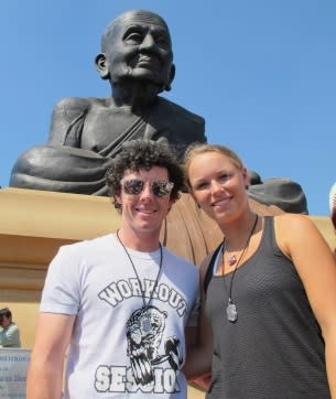 Rory McIlroy and Caroline Wozniacki visita temple in Thailand. Picture: Reuters