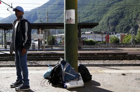 A migrant waits at the Bolzano railway station, northern Italy, May 28, 2015. REUTERS/Stefano Rellandini