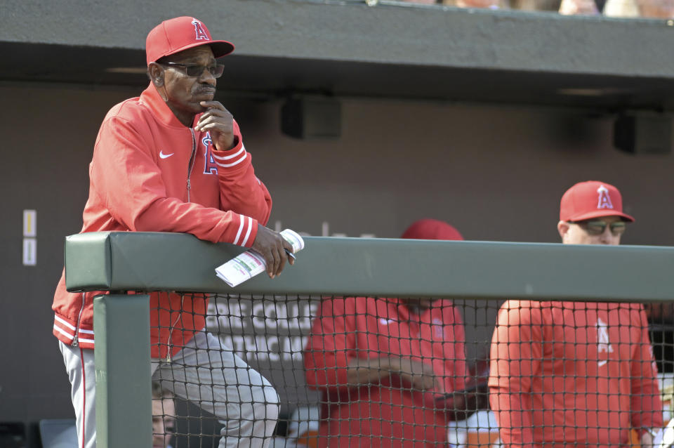 Los Angeles Angels manager Ron Washington watches as his team plays against the Baltimore Orioles in a baseball game, Sunday, March 31, 2024, in Baltimore. (AP Photo/Steve Ruark)