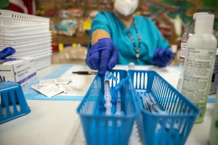 A nurse fills a syringe with the Moderna Covid-19 vaccine at a vaccination site in San Antonio, Texas in this file photo taken on March 29, 2021