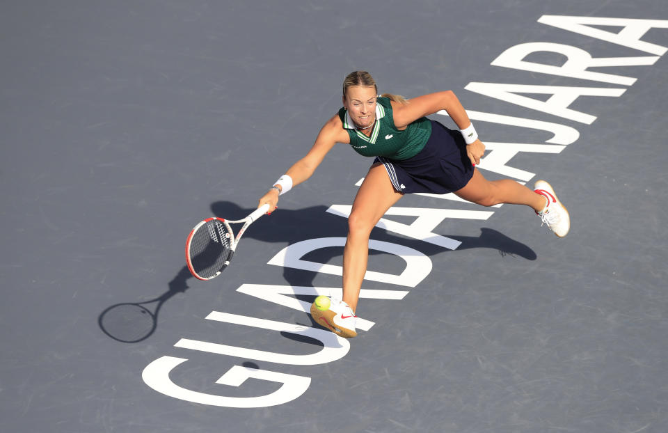 Anett Kontaveit of Estonia returns a shot to Czech Republic's Barbora Krejcikova during a match of the Mexican Tennis WTA Finals in Guadalajara, Mexico, Wednesday, Nov. 10, 2021. (AP Photo/Refugio Ruiz)