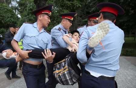 Kazakh opposition supporters hold a rally in Almaty