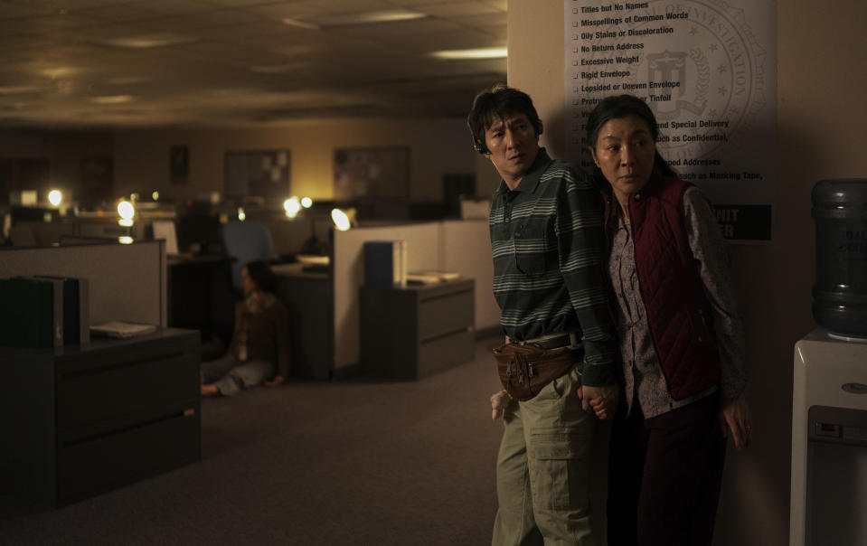 This image released by A24 Films shows Ke Huy Quan, left, and Michelle Yeoh in a scene from "Everything Everywhere All at Once." (Allyson Riggs/A24 via AP)