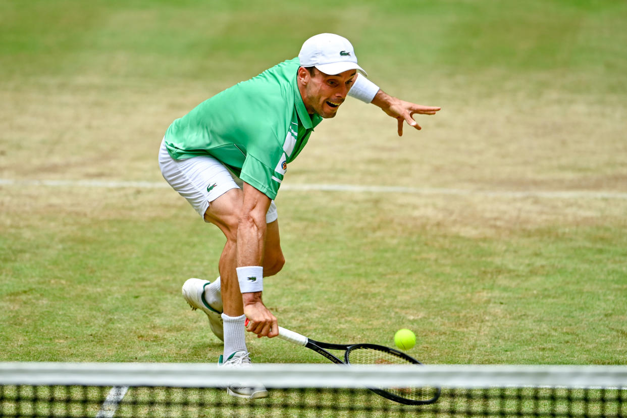 HALLE, GERMANY - JUNE 17: Roberto Bautista Agut of Spain plays a backhand in his match against Daniil Medvedev of Russia during day seven of the 29th Terra Wortmann Open at OWL-Arena on June 17, 2022 in Halle, Germany. (Photo by Thomas F. Starke/Getty Images)