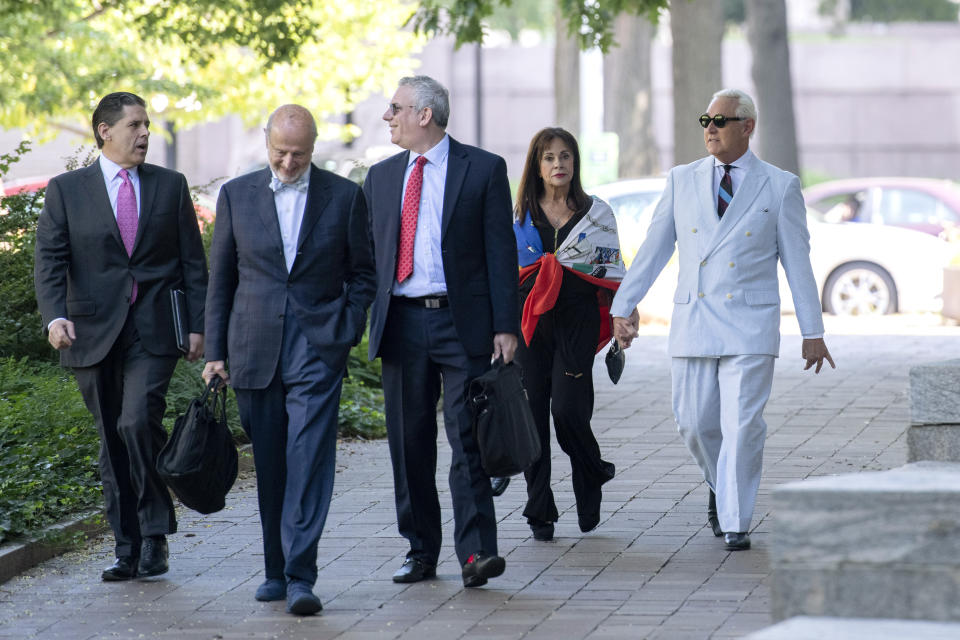 Roger Stone, right, a longtime confidant of President Donald Trump, accompanied by his wife, Nydia Stone, and lawyers, arrives at federal court in Washington, Tuesday, July 16, 2019. (AP Photo/Sait Serkan Gurbuz)