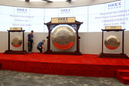 Gongs are prepared for the listing of China Tower Corporation Limited and BeiGene Ltd at the Hong Kong Exchanges in Hong Kong, China August 8, 2018. REUTERS/Bobby Yip