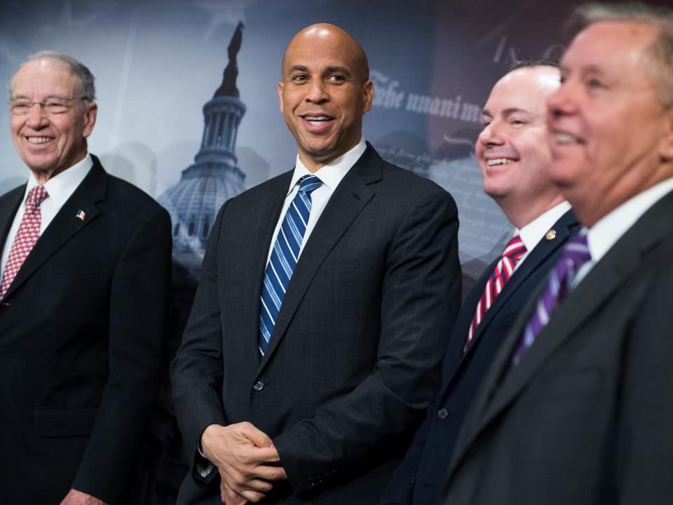 Chuck Grassley, Cory Booker, Mike Lee and Lindsay Graham after criminal justice reform bill passed