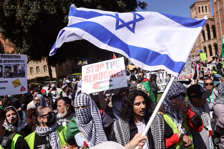 Los Angeles, CA – April 28: Pro-Israeli and Palestinian demonstrators clash in a demonstration, nearby where pro-Palestinian students have maintained a tent encampment for days at UCLA on Sunday, April 28, 2024 in Los Angeles, CA. (Dania Maxwell / Los Angeles Times via Getty Images)