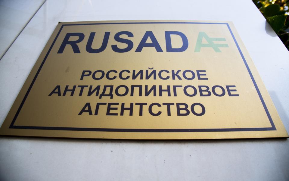 A sign reading "Russian National Anti-doping Agency RUSADA" on a building in Moscow, Russia, Thursday, Sept. 20, 2018. The World Anti-Doping Agency has reinstated Russia, ending a nearly three-year suspension caused by state-sponsored doping. (AP Photo/Alexander Zemlianichenko)