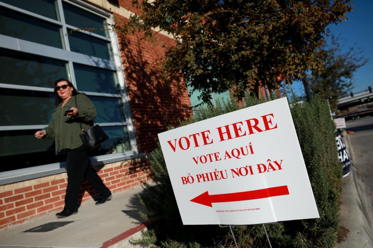 <span class="caption">A voter exits a polling location on Election Day, Nov. 3, 2020 in Fort Worth, Texas. </span> <span class="attribution"><a class="link " href="https://www.gettyimages.com/detail/news-photo/voter-exits-a-polling-location-on-november-03-2020-in-fort-news-photo/1283708803?adppopup=true" rel="nofollow noopener" target="_blank" data-ylk="slk:Tom Pennington/Getty Images;elm:context_link;itc:0;sec:content-canvas">Tom Pennington/Getty Images</a></span>