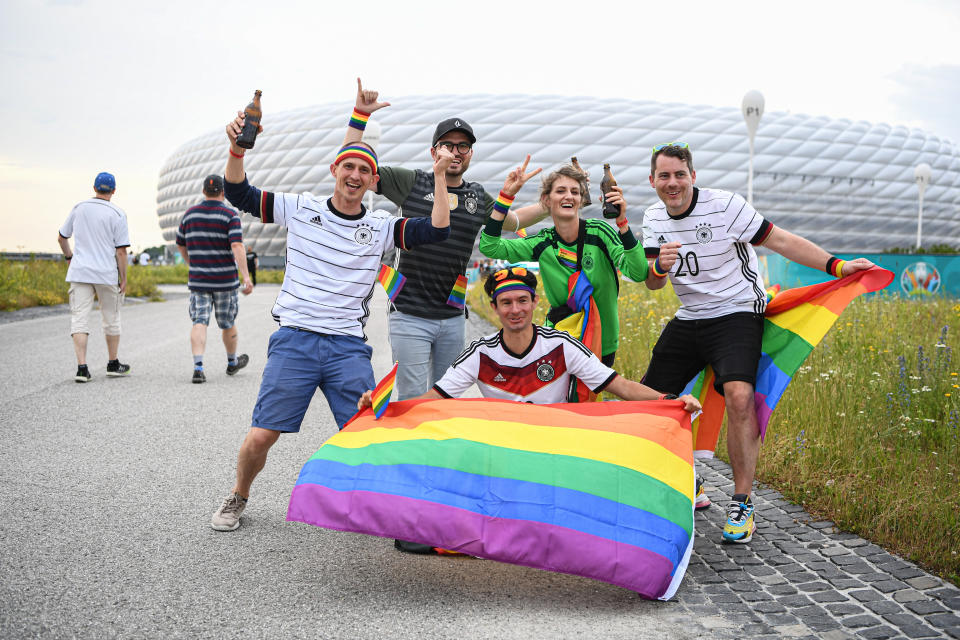 MUNICH, GERMANY - JUNE 23: Fans of Germany stay together with a rainbow flag ahead of the UEFA Euro 2020 Championship Group F match between Germany and Hungary at Football Arena Munich on June 23, 2021 in Munich, Germany. (Photo by Markus Gilliar/Getty Images)