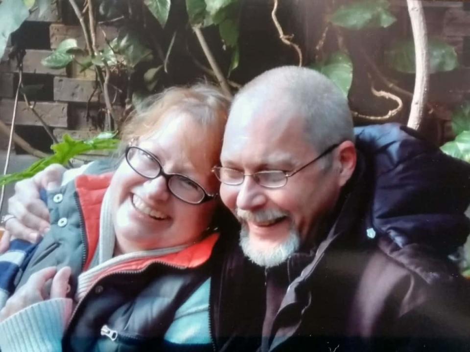 Eric De Schepper says it's an outrage that his partner, Katherine Ellis, had to go without palliative home care in her dying days, and that others have had to go through the same experience. (Submitted by Eric De Schepper - image credit)