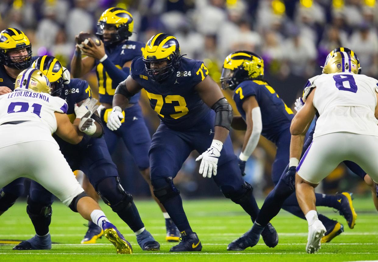 Might the Patriots draft former Michigan offensive tackle LaDarius Henderson (73) to go with his former teammate, quarterback J.J. McCarthy, in this week's NFL Draft?