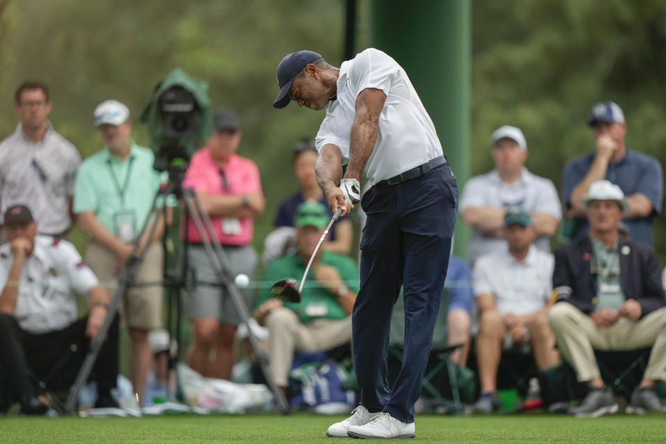Tiger Woods hits his tee shot on the 18th hole during the first round of the Masters golf tournament at Augusta National Golf Club on Thursday, April 6, 2023, in Augusta, Ga. (AP Photo/Charlie Riedel)