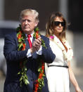 <p>Adorned with lei, President Donald Trump walks with first lady Melania Trump to meet servicemen, Friday, Nov. 3, 2017 at Joint Base Pearl Harbor Hickam in Honolulu. (Jamm Aquino/The Star-Advertiser via AP) </p>