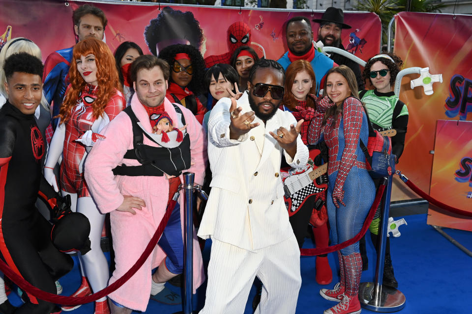 Shameik Moore poses with fans in fancy dress at the “Spider-man: Across The Spider-Verse” Gala Screening at Cineworld Leicester Square on June 01, 2023 in London, England.