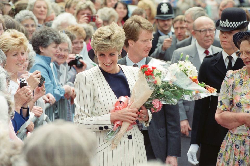 <p>Diana chose a classic striped blazer for a flower-filled walkabout in Sheffield in July 1991.<br></p>