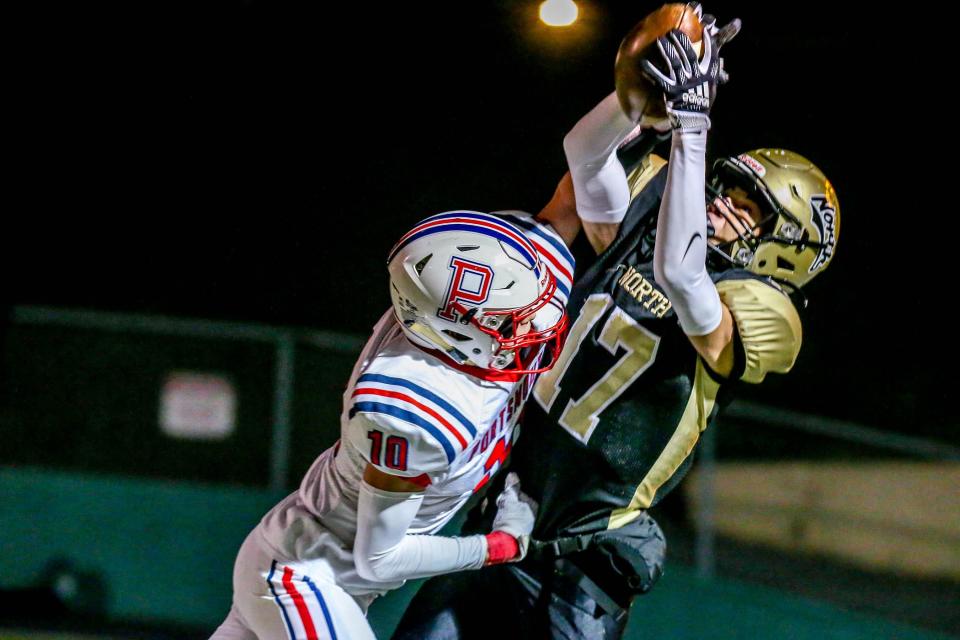 WR Noah Gincastro hauls in a TD pass to put North Kingstown up 23-10 in second half action. Portsmouth's Evan Tullson (10).