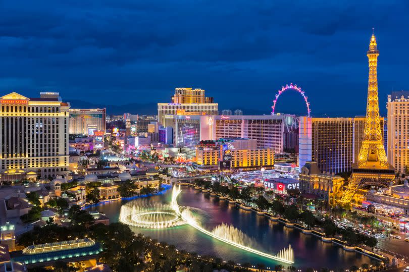 USA, Nevada, Las Vegas, Strip, fountain, hotels and Eiffel Tower at blue hour