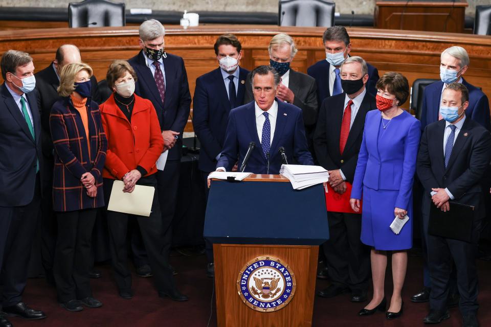 Sen. Mitt Romney (R-UT) speaks alongside a bipartisan group of members of Congress as they announce a proposal for a Covid-19 relief bill on Capitol Hill on December 14, 2020 in Washington, DC. Lawmakers from both chambers released a $908 billion package Monday, split into two bills.