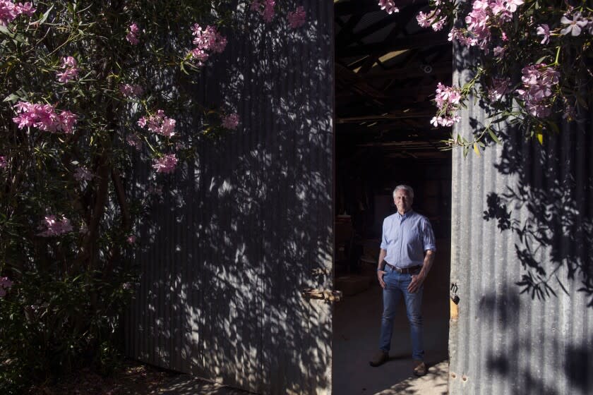 Walnut farmer and socialist activist Craig McNamara sits for portraits in his barn on Thursday, June 2, 2022 in Winters, CA.