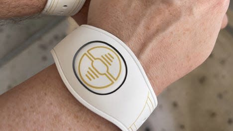 A white databand on the writer's wrist