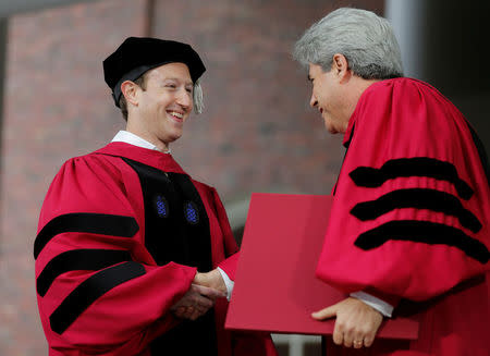 Facebook founder Mark Zuckerberg accepts an honorary Doctor of Laws degree from Marc Goodheart, Secretary of the Board of Overseers, during the 366th Commencement Exercises at Harvard University in Cambridge, Massachusetts, U.S., May 25, 2017. REUTERS/Brian Snyder