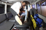 <p>A wounded person is treated in an ambulance after a complex Taliban attack on the campus of the American University in the Afghan capital Kabul on Wednesday, Aug. 24, 2016. . (AP Photo/Rahmat Gul) </p>