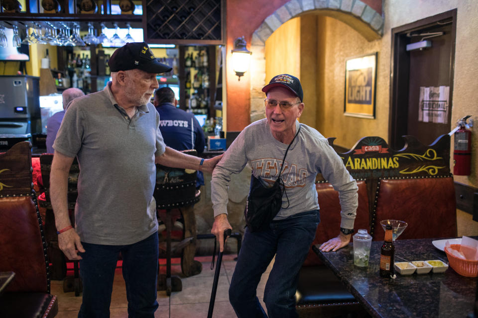 Richard Blakely helps Yarling stand up after dining together at a Mexican restaurant in Austin. (Photo: Tamir Kalifa for HuffPost)