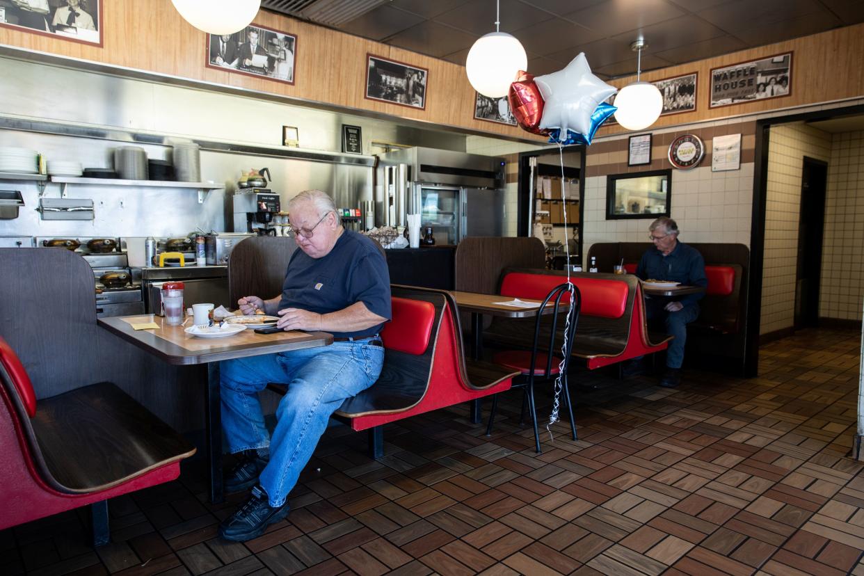 Men are pictured at a Waffle House, one of few corporate restaurant chain reopened for  in-house dining after a shutdown to prevent the spread of the coronavirus disease (COVID-19) in Madison, Georgia, U.S., April 27, 2020.  REUTERS/Maranie Staab