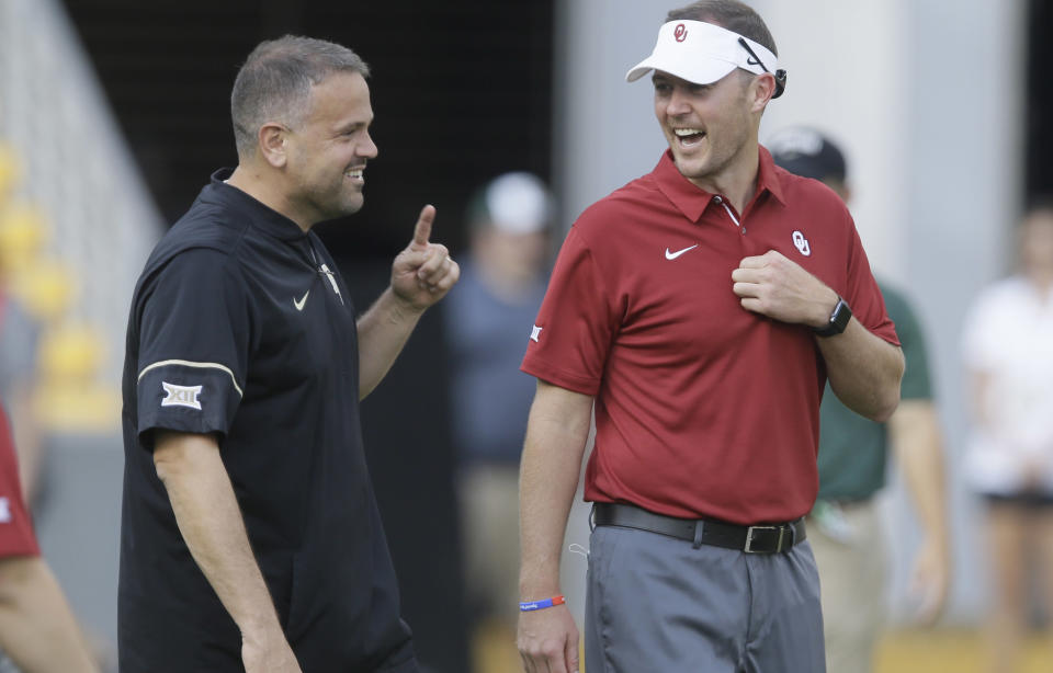 Oklahoma head coach Lincoln Riley, right, and Baylor head coach Matt Rhule visit on the field before an NCAA college football game in Waco, Texas, Saturday, Sept. 23, 2017. (AP Photo/LM Otero)