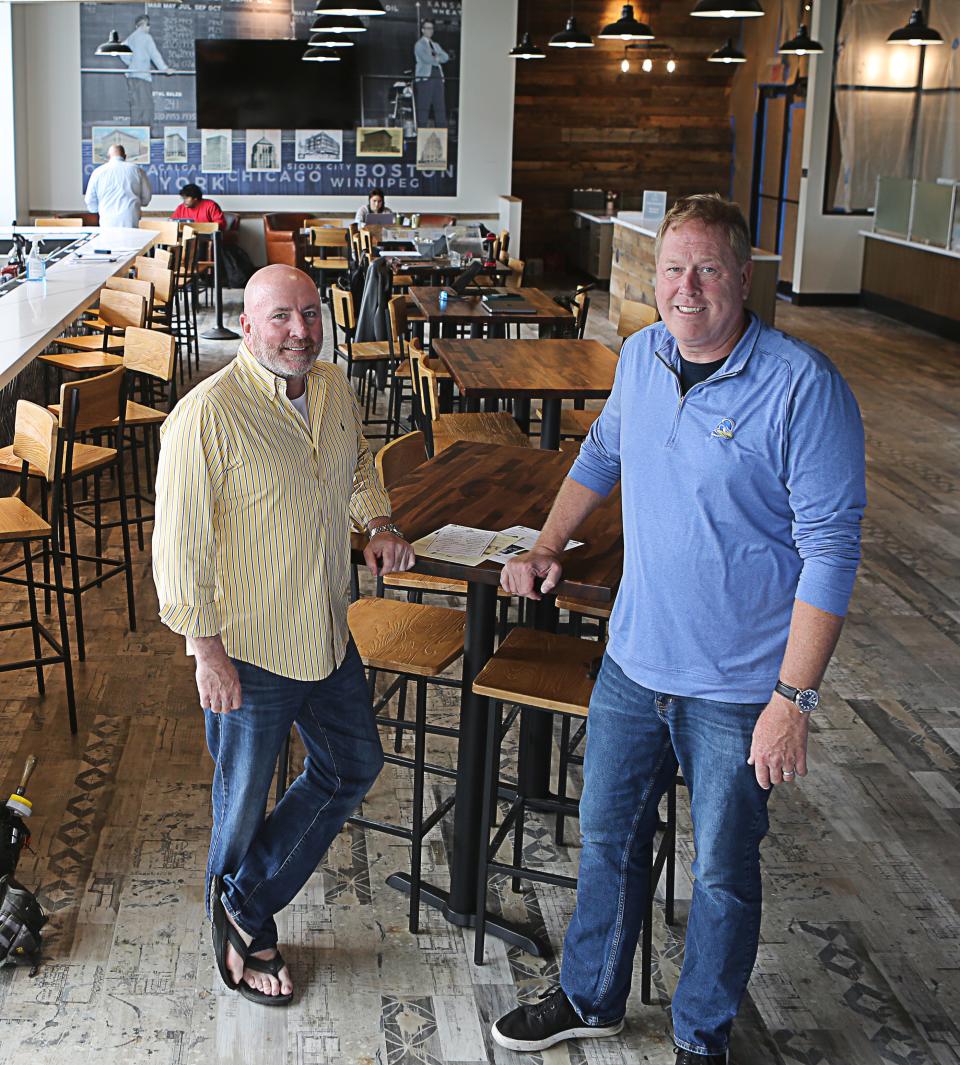 Jim O'Donoghue (left) and Lee Mikles (right), co-owners of The Grain Exchange, are preparing to open their sixth location at the University of Delaware's STAR Campus later this month.