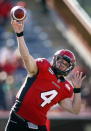 Calgary Stampeders' quarterback Drew Tate delivers a pass during first half CFL football action against the Montreal Alouettes in Calgary, Alta., Sunday, July 1, 2012. THE CANADIAN PRESS/Jeff McIntosh