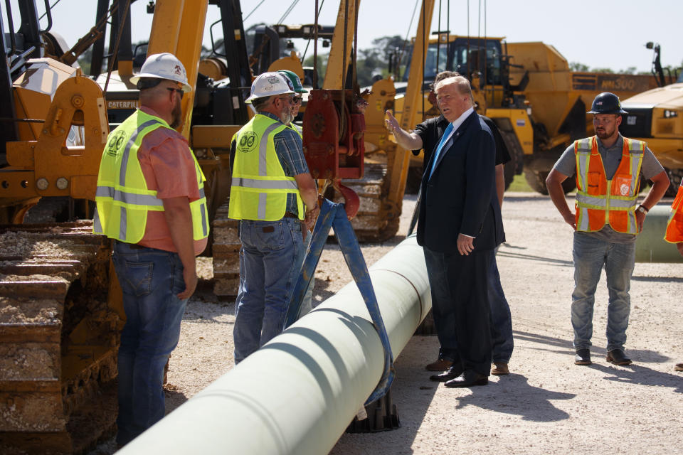 President Donald Trump takes a tour before speaking about energy and infrastructure at the International Union of Operating Engineers International Training and Education Center, Wednesday, April 10, 2019, in Crosby, Texas. (AP Photo/Evan Vucci)