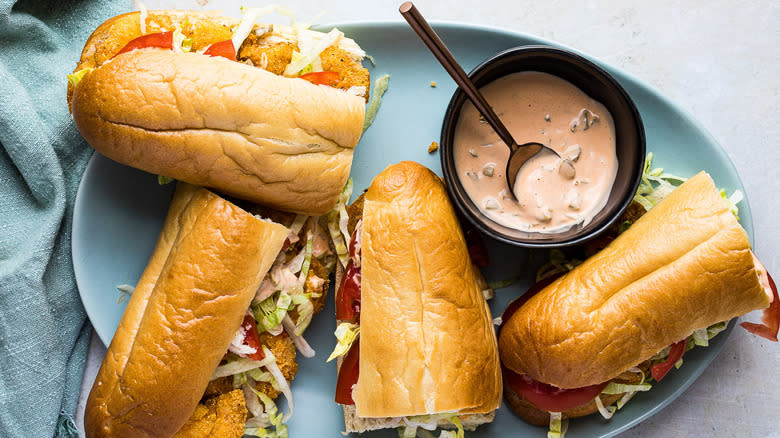 Shrimp po boy plated with chips 