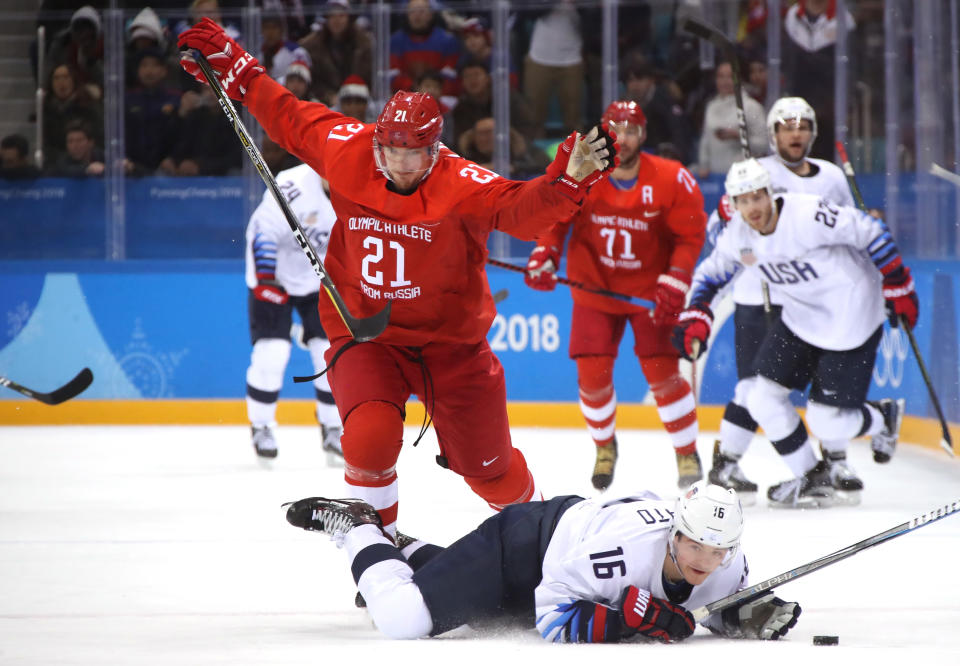 Sergei Kalinin #21 of Olympic Athlete from Russia falls to the ice after tripping Ryan Donato #16 of the United States during the Men's Ice Hockey Preliminary Round Group B game on day eight of the PyeongChang 2018 Winter Olympic Game