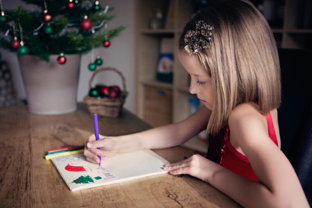 girl writing a letter to santa