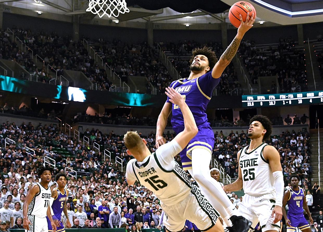 Julien Wooden (22) and James Madison shocked the Spartans in East Lansing. (Dale Young/Reuters)