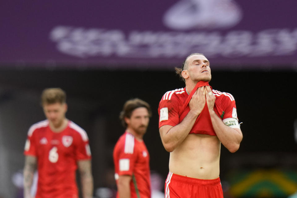 Wales' Gareth Bale reacts at the end of the World Cup group B soccer match between Wales and Iran, at the Ahmad Bin Ali Stadium in Al Rayyan, Qatar, Friday, Nov. 25, 2022. (AP Photo/Alessandra Tarantino)