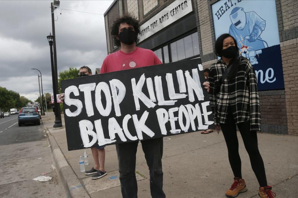 Protesters gather near the site of the death of a man in Minneapolis. Source: AP